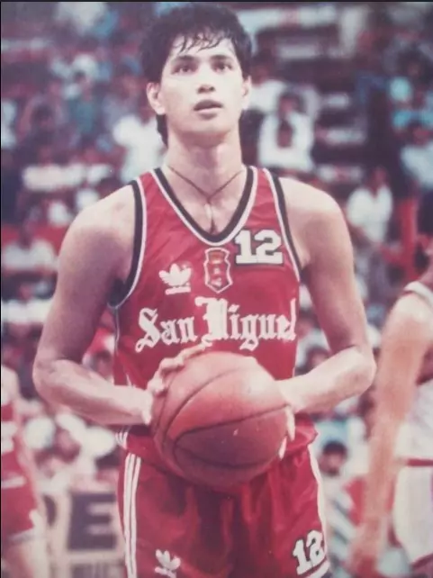 a man taking a free throw in basketball game